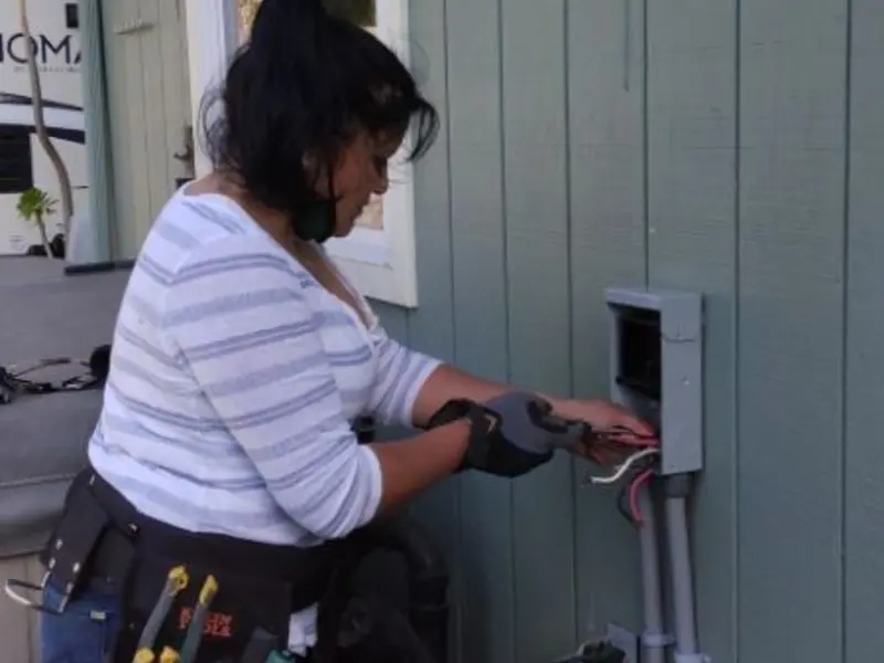 Licensed electrician wiring an exterior subpanel in Lake Panasoffkee