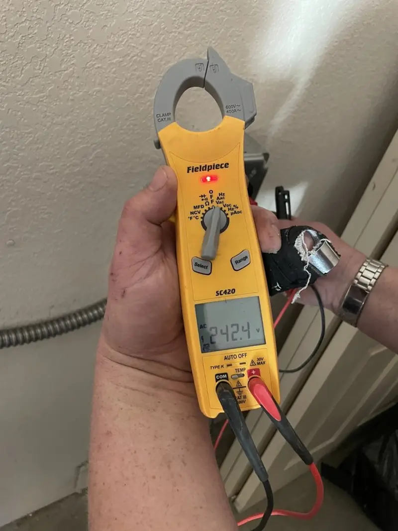 Voltage testing with clamp meter during Electrical Installation Services in Lake Panasoffkee